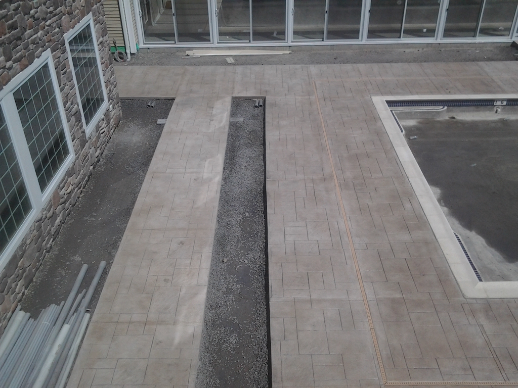 Paver installation creating a structured and decorative residential hardscape